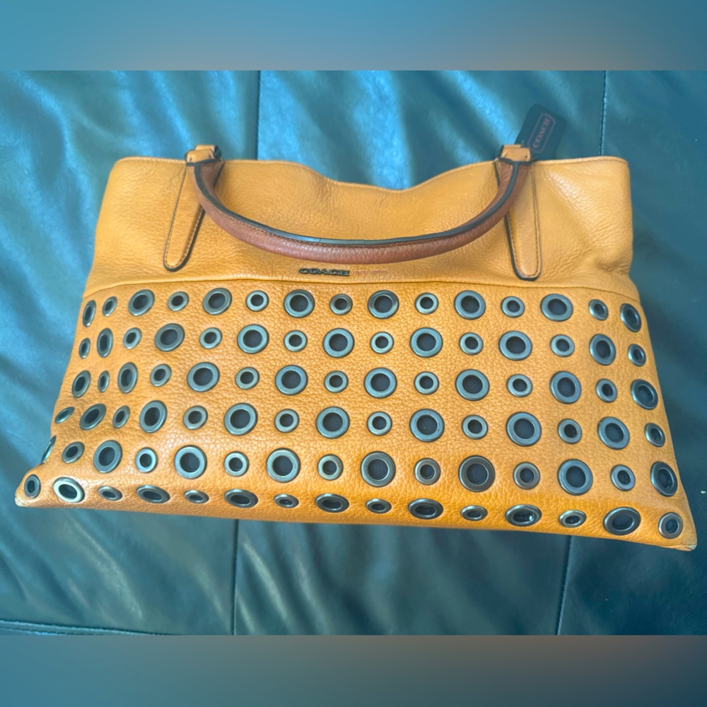 Coach leather grommet borough satchel 
purse.  14L 6W 8.5H